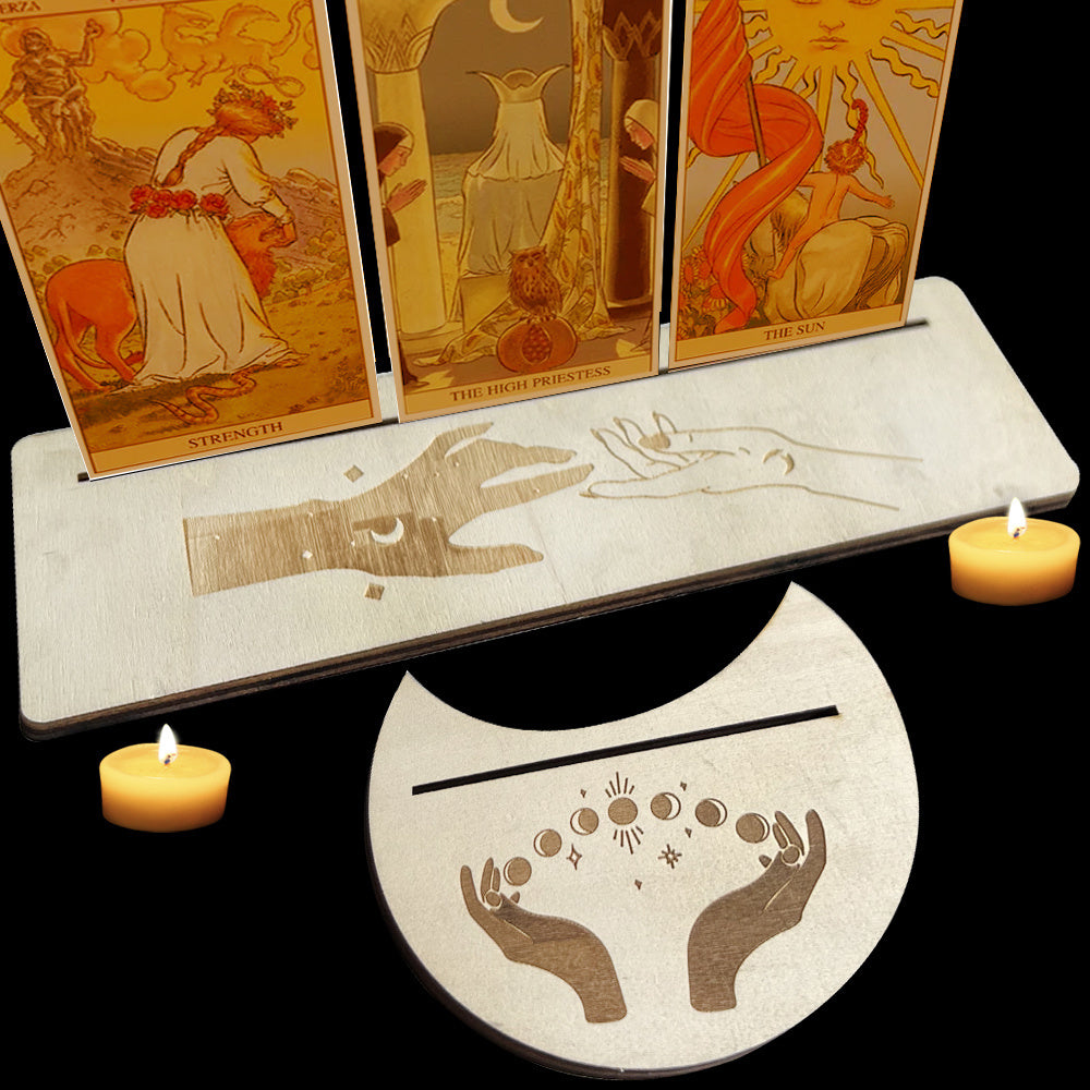 Tarot cards with a reading surface and candles on a black background