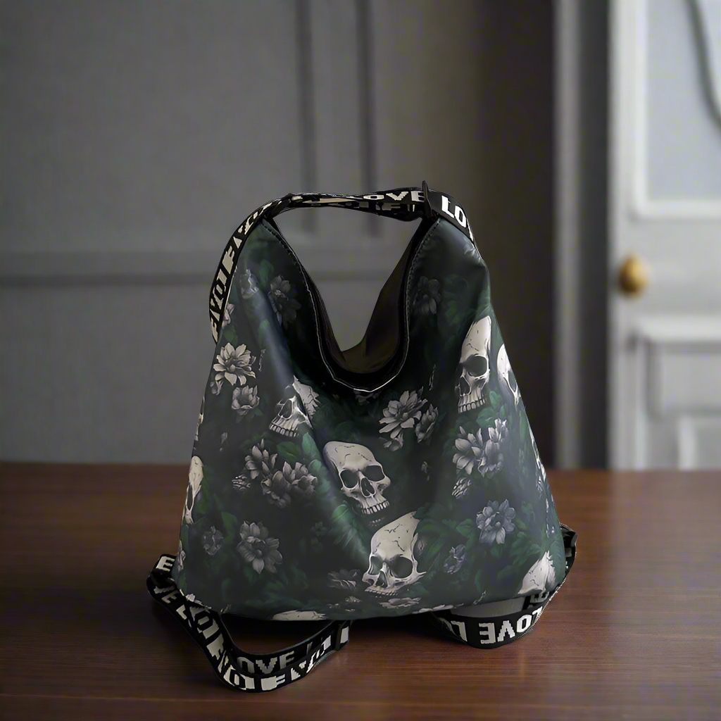 Drawstring bag with skull and floral pattern on a wooden surface