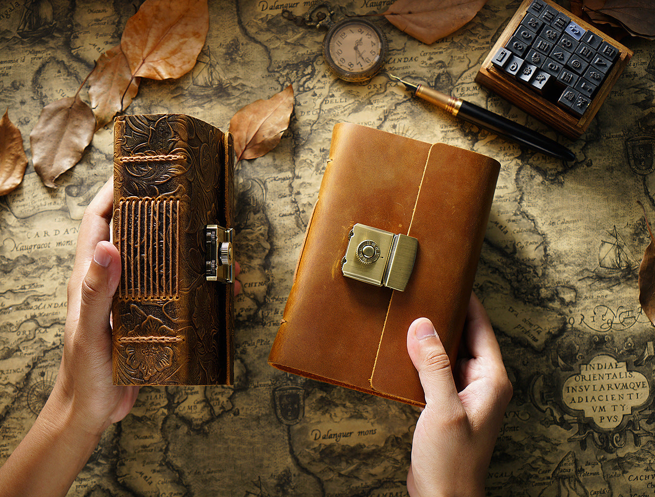 Two leather-bound books held by hands on a map background
