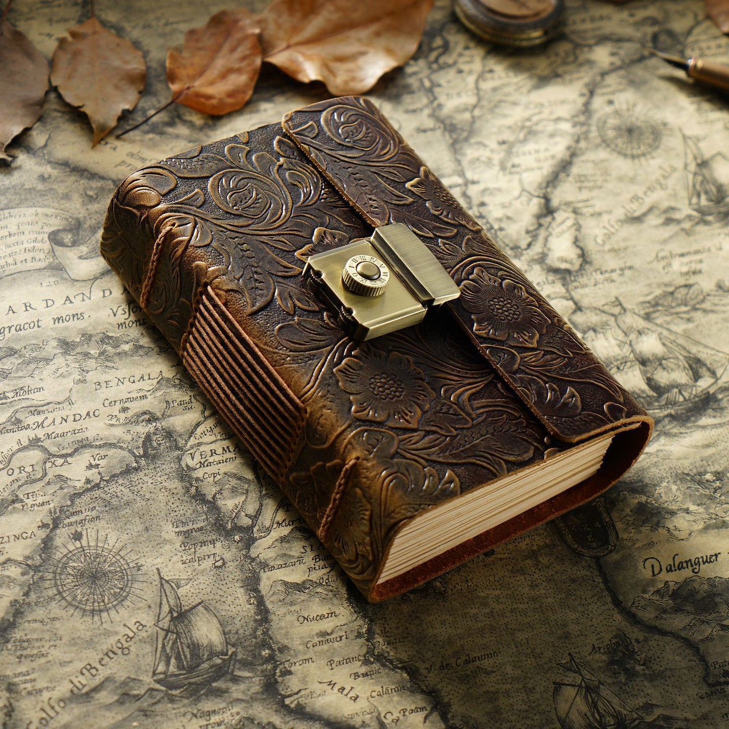 Decorative leather-bound book with a lock on an old map background