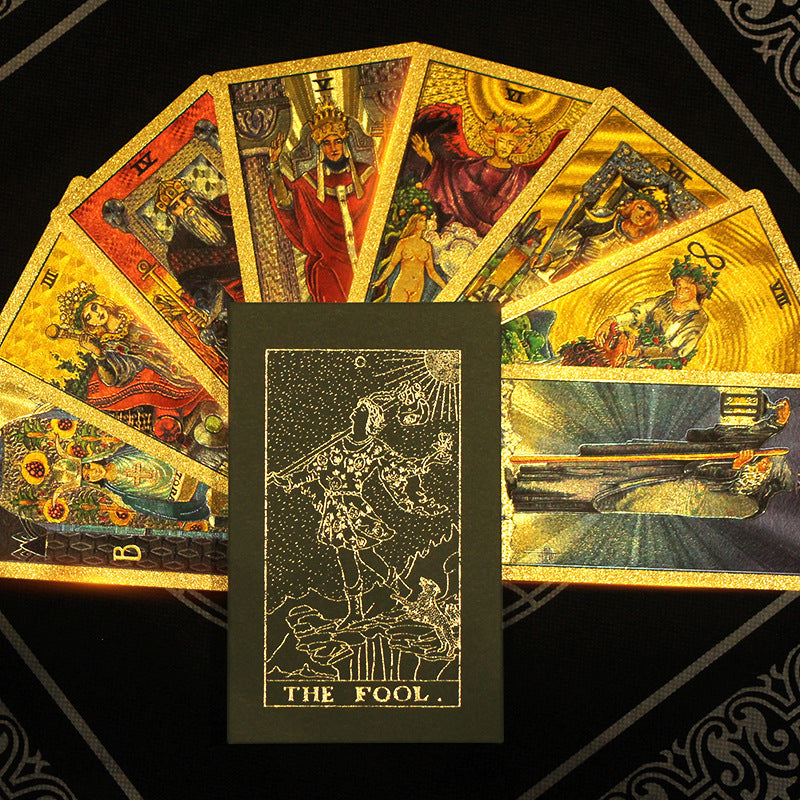 Fanned tarot cards with 'The Fool' card prominently displayed on a black background