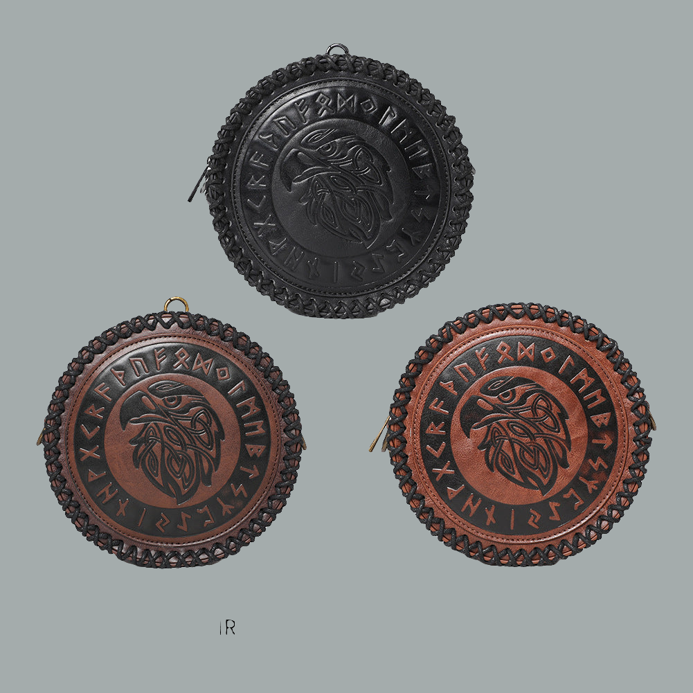 Three round leather pouches with embossed designs on a gray background